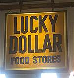 Great light up Lucky Dollar Food Store Sign